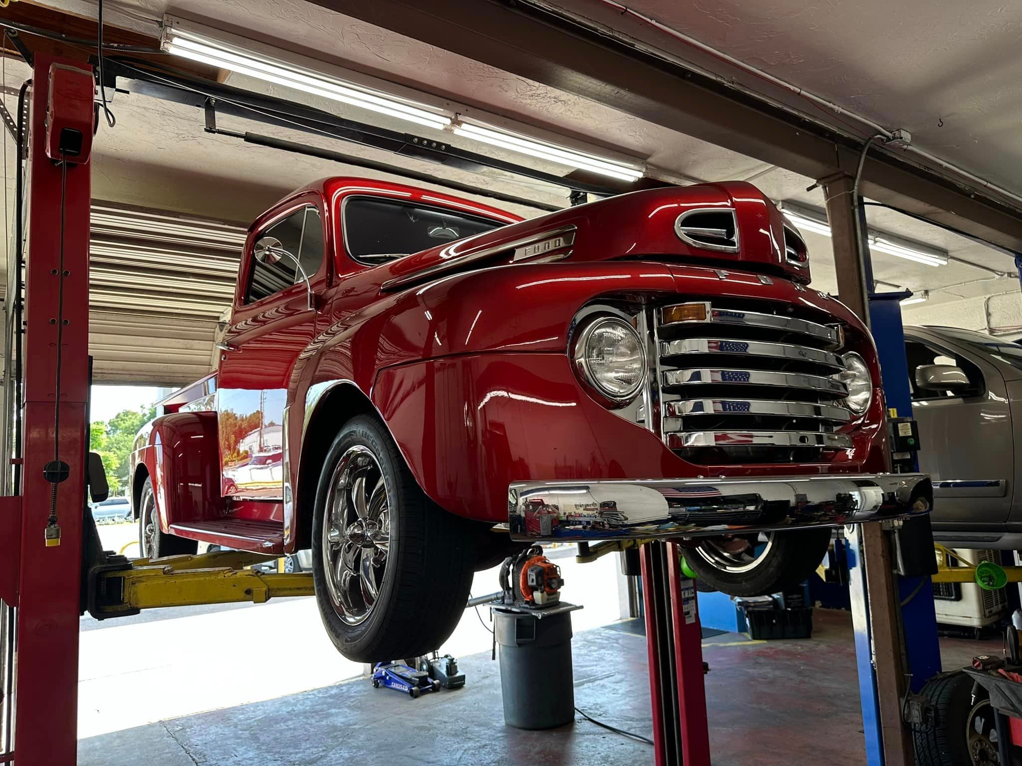 Classic truck on lift at Beckley Auto Repair